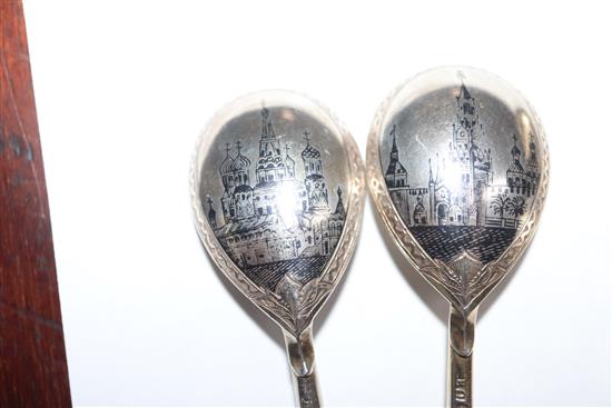 A Russian 84 zlotnik silver gilt and niello spoon, assay master probably Andrei Koralsky, 1842, L 17.5cm and four other Russian spoons